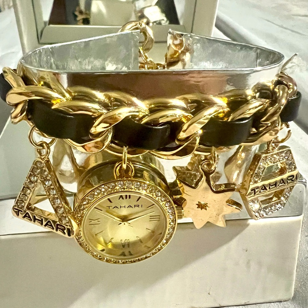 Charm Bracelet/Watch. Gold and black leather,  brand new with tags and box.